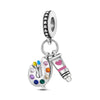 A silver heart charm bead with pink zircon and a dangling charm on a silver chain.