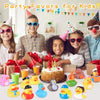 A group of children holding assorted rubber ducks and party favors for kids