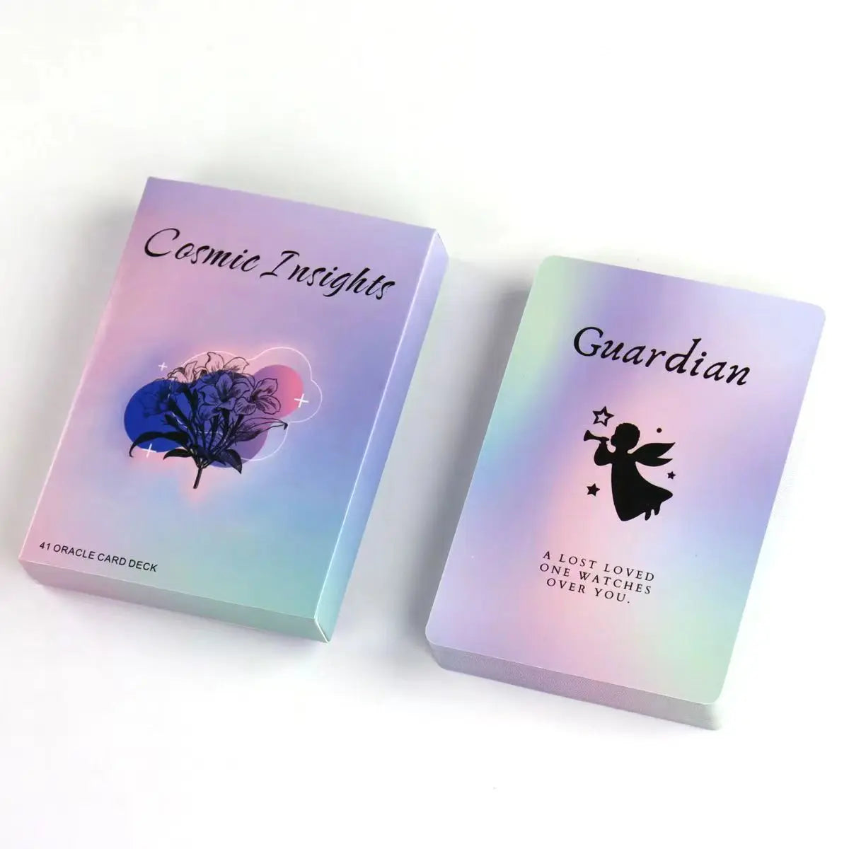 A purple and green box for the Cosmic Insights Oracle Deck featuring a Guardian card.