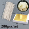 A set of 200 pre-waxed cotton candle wicks with metal sustainers and gold foil papers for crafting