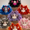 A collection of nine-tailed fox plush collectibles in various colors including blue, red, purple, and orange.