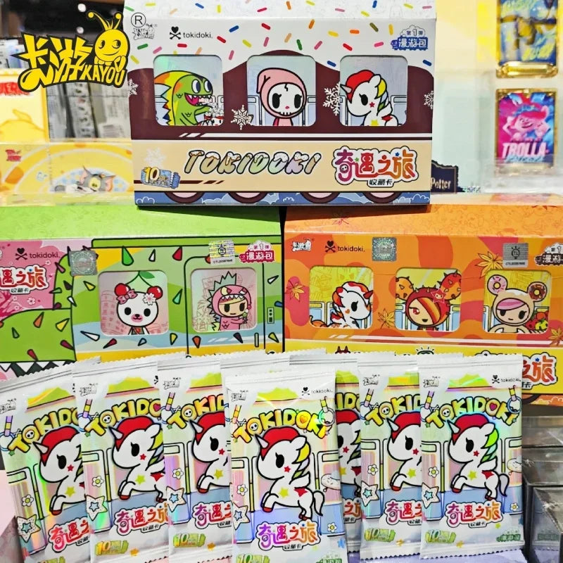 A box of Tokidoki Unicorn Adventure Journey Series Vol.1 collectible cards featuring colorful unicorn characters.