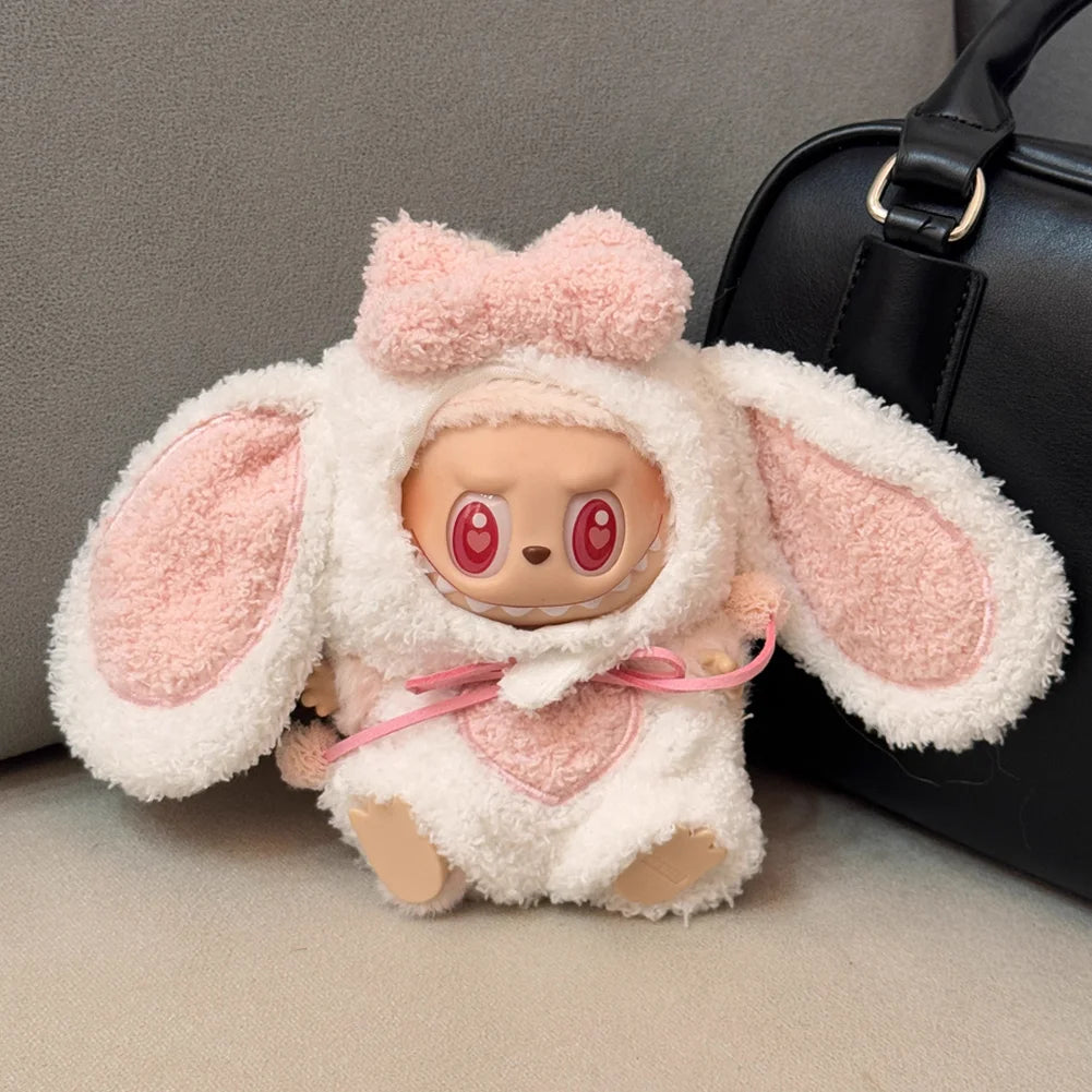 A plush rabbit costume for a doll featuring pink and white fluffy fur and long ears.