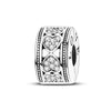 A sterling silver charm bead featuring intricate heart and cross designs pave-set with clear stones.