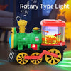A green electric steam train truck with lights and a rotating top is shown on a dark surface.