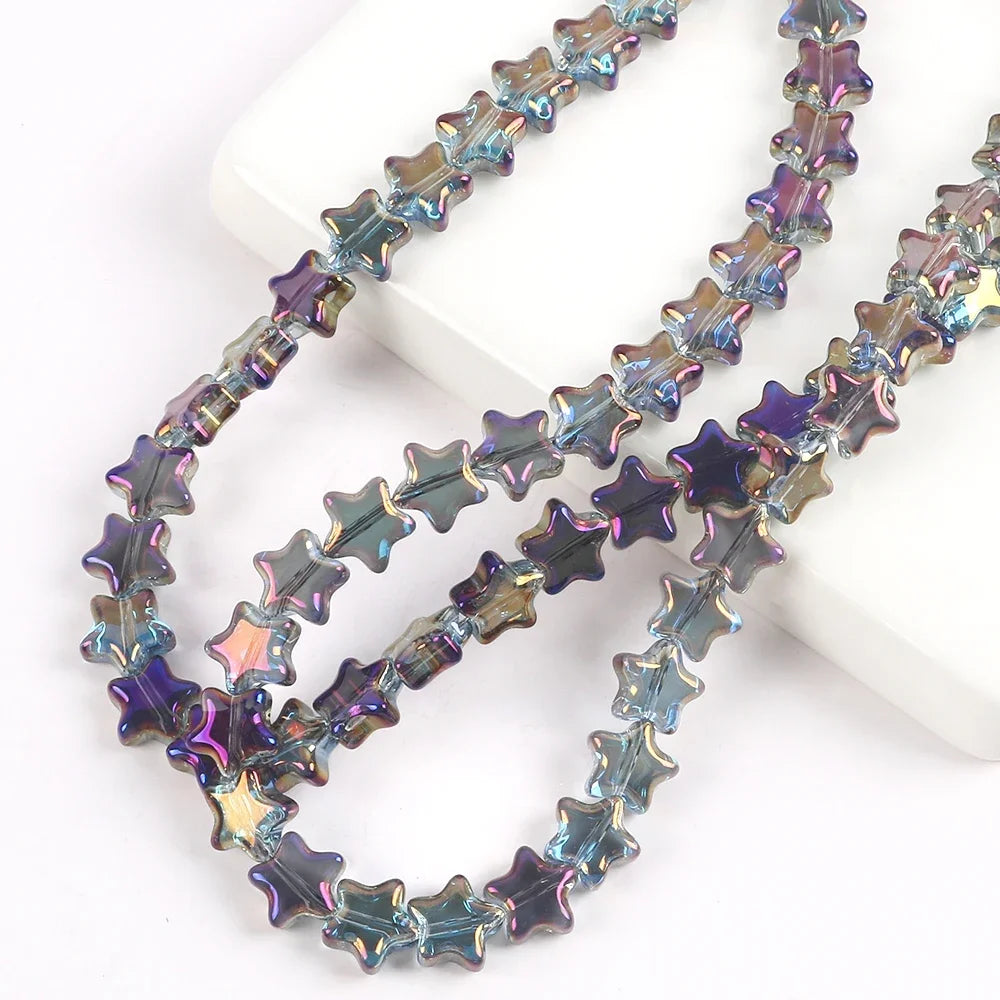 A strand of iridescent blue and purple glass star spacer beads for jewelry making