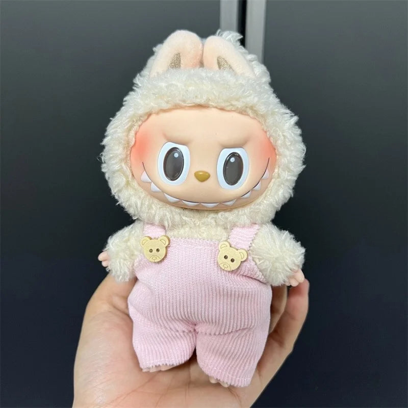 Labubu doll wearing a pink knit outfit and fluffy white hood