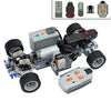 A disassembled Power Functions motor and servo set for building blocks, showing various components and accessories.