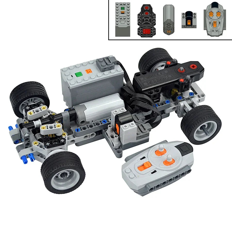 A disassembled Power Functions motor and servo set for building blocks, showing various components and accessories.