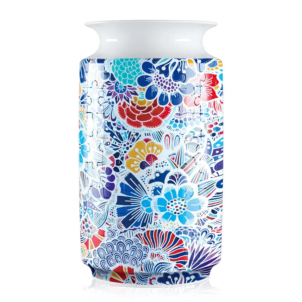 Blue and white porcelain 3D puzzle shaped like a flower vase with intricate floral patterns
