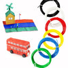 A collection of multi-colored PLA filament spools and a miniature house model.