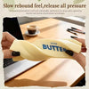 A hand holds a yellow butter squishy stress relief toy with the word salted butter visible on it.