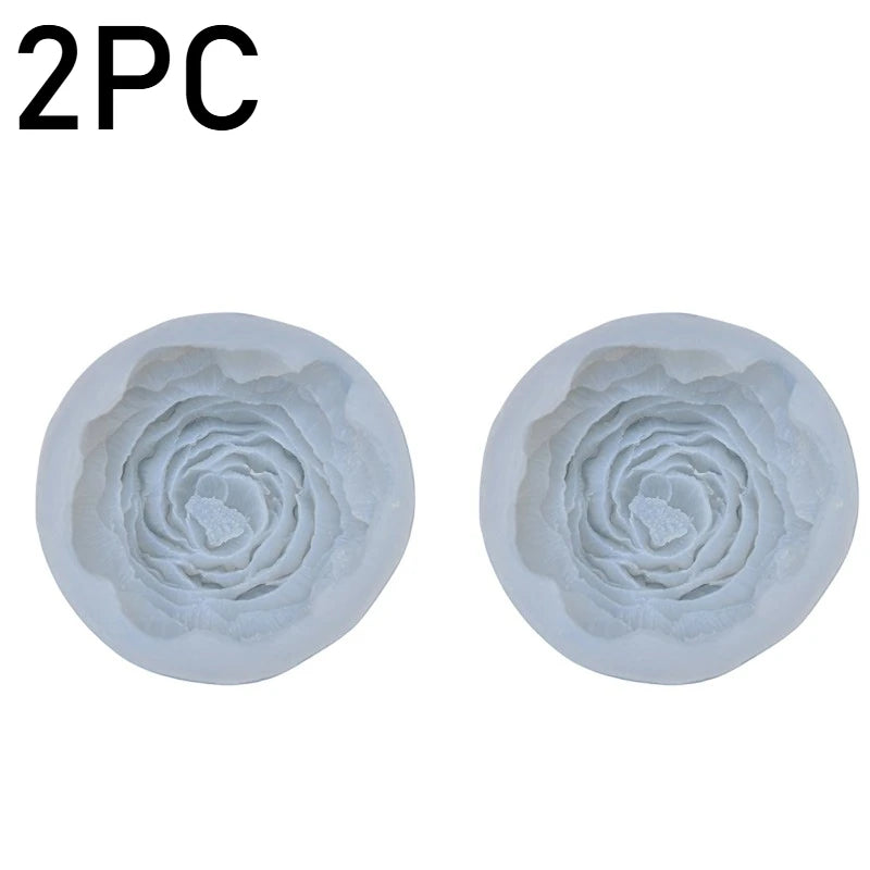Two silicone molds shaped like peony flowers for baking, chocolate, soap, and craft projects.