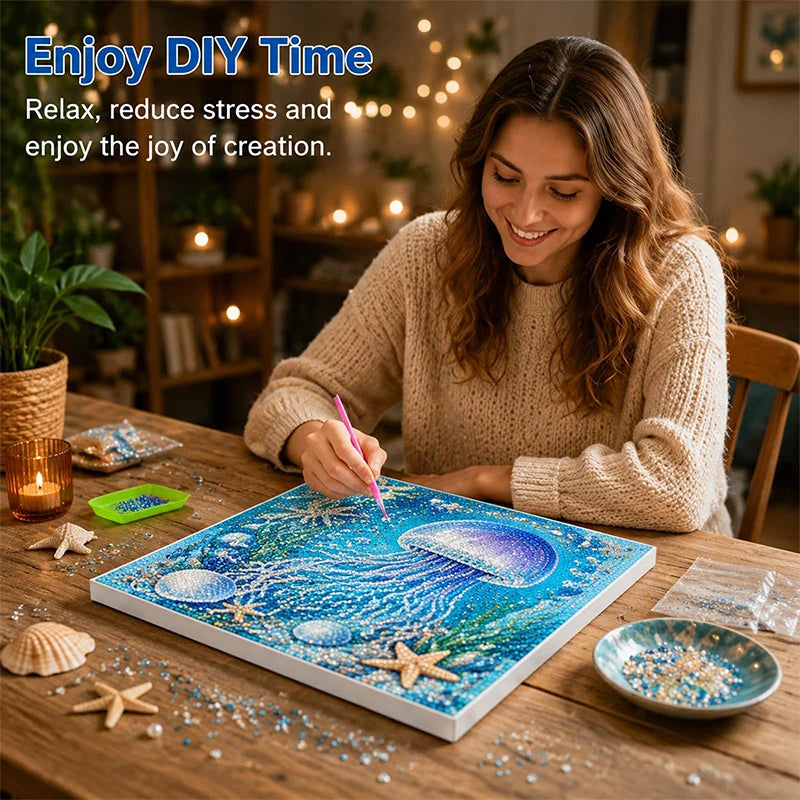 A woman enjoys a DIY diamond art kit featuring ocean themes like sharks and turtles on a wooden table.