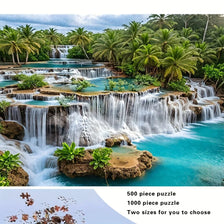 A vibrant tropical waterfall scene featuring lush green foliage and clear blue water, suitable for a 500 or 1000 piece puzzle