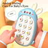 A hand holds a blue rabbit-shaped toy phone designed for baby's eyes, showing various buttons and learning features.