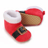 A pair of red animal-themed baby first walker shoes with white faux fur trim and brown leather accents.