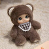 A soft brown plush pendant featuring a bear face with white ears and a checkered collar.
