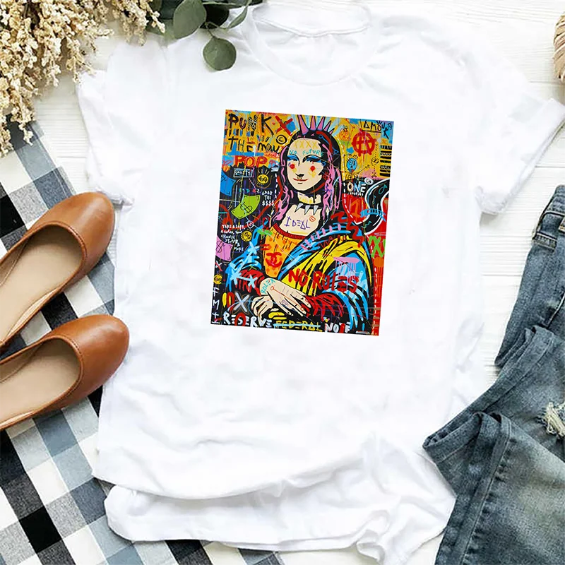A white t-shirt featuring a colorful, stylized artwork print on the chest.