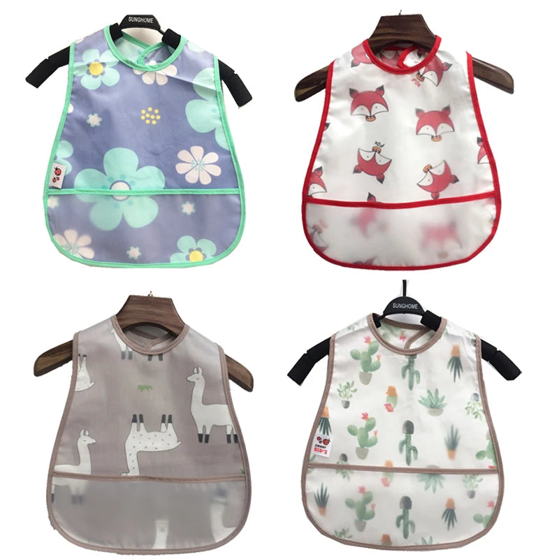 A set of cartoon pattern waterproof baby bibs for toddlers in various pastel colors and designs.