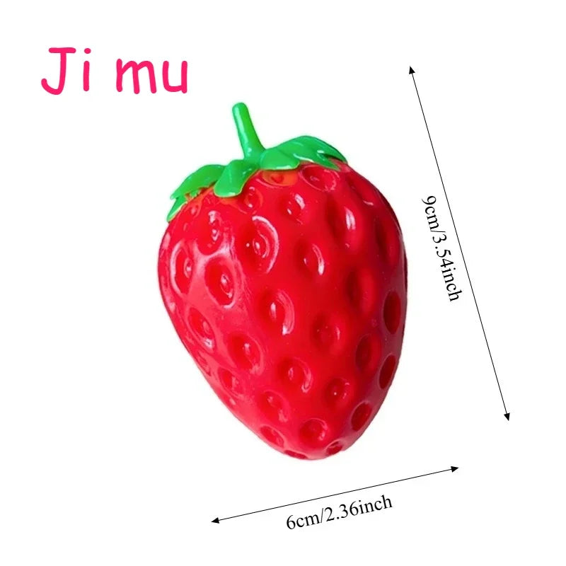 A bright red strawberry stress ball with a green leafy top.