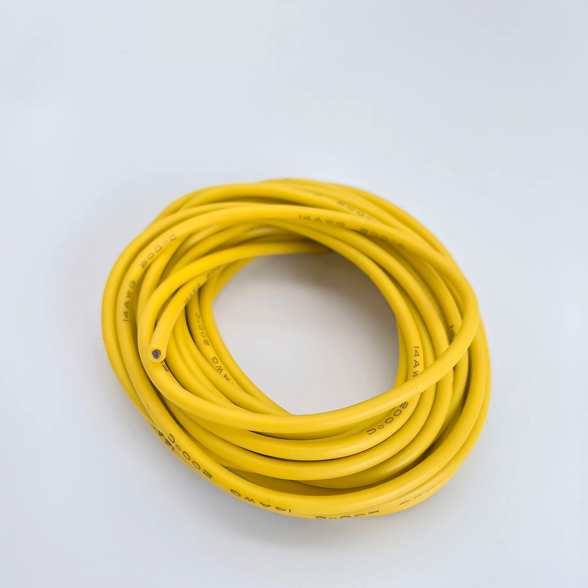 A coil of yellow flexible silicone tinned copper wire with multiple AWG gauges.