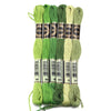 A set of six skeins of vibrant embroidery thread in various shades of green and lime for cross stitch and DIY crafts