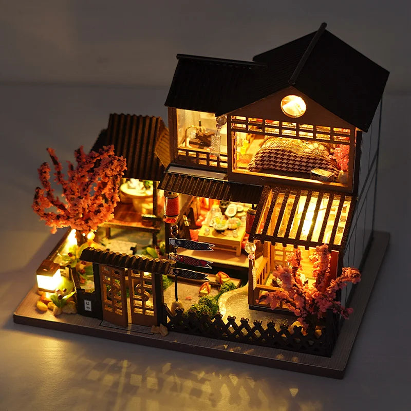 A detailed wooden dollhouse featuring furniture, illuminated by warm LED lighting.