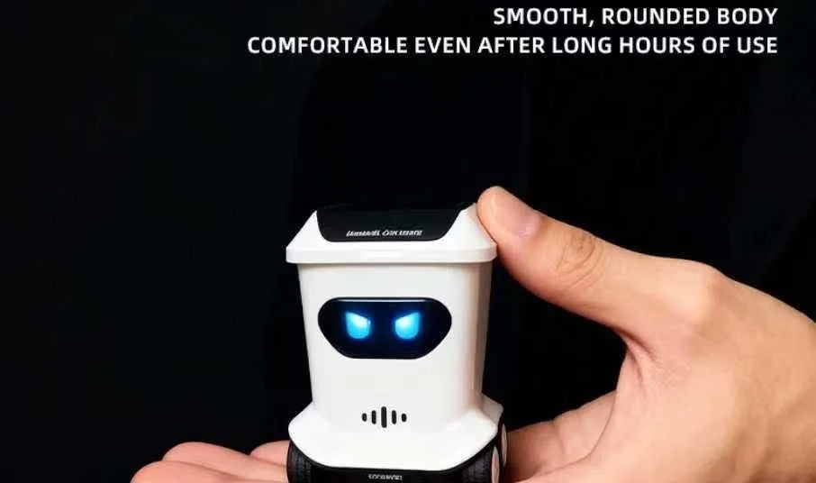A hand holds a white electronic device resembling a robot face, likely a mini remote control trash can toy.