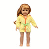 A doll wearing a yellow cartoon animal bathrobe or nightgown set with orange trim and a green tie.