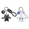 A black dragon keychain featuring a sculpted head with glowing green eyes and movable wings.