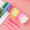 A collection of 36 colored air dry modeling clay and sculpting tools arranged in a plastic bag on a pink background.