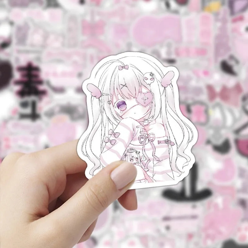 A hand holds a white sticker featuring an anime girl with long pink hair and pink striped clothing.