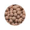 A pile of assorted silicone beads in a natural beige or tan color.