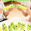 Children holding and comparing yellow plastic fish toys used in an educational fishing game