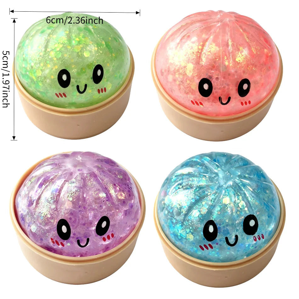 Three glitter sensory squishy fidget toys in green, pink, and blue are shown in a circular top with cute faces.
