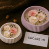 Pink roses and lavender flowers displayed in a round silicone mold for DIY planters and decor