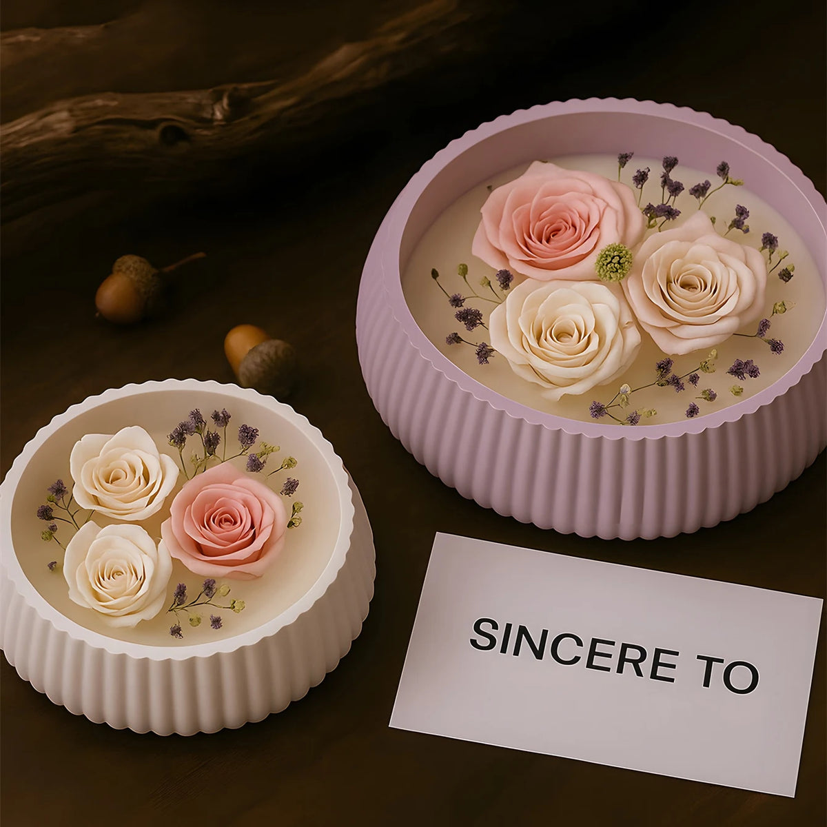 Pink roses and lavender flowers displayed in a round silicone mold for DIY planters and decor