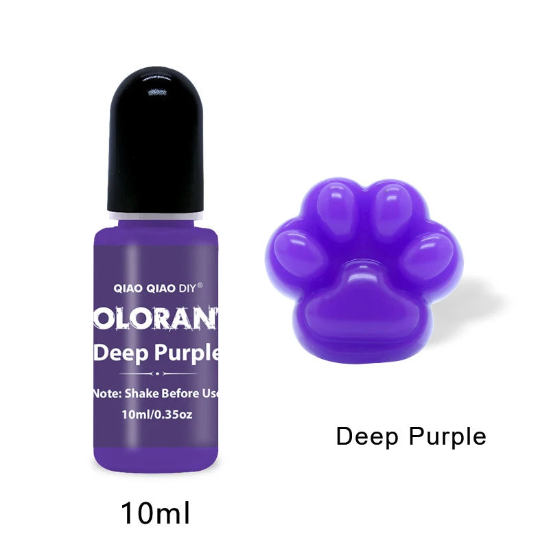 A purple liquid pigment bottle labeled Olorant Deep Purple with a cat paw shape on the cap and a purple paw print design.