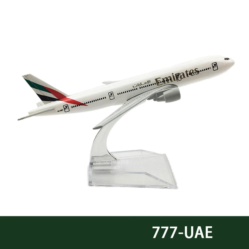 A diecast model of an Emirates Boeing airplane in white and green livery.
