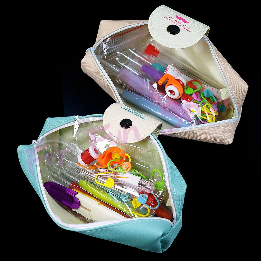 A complete crochet hook and knitting needle kit stored in a light pink fabric bag with clear plastic storage.