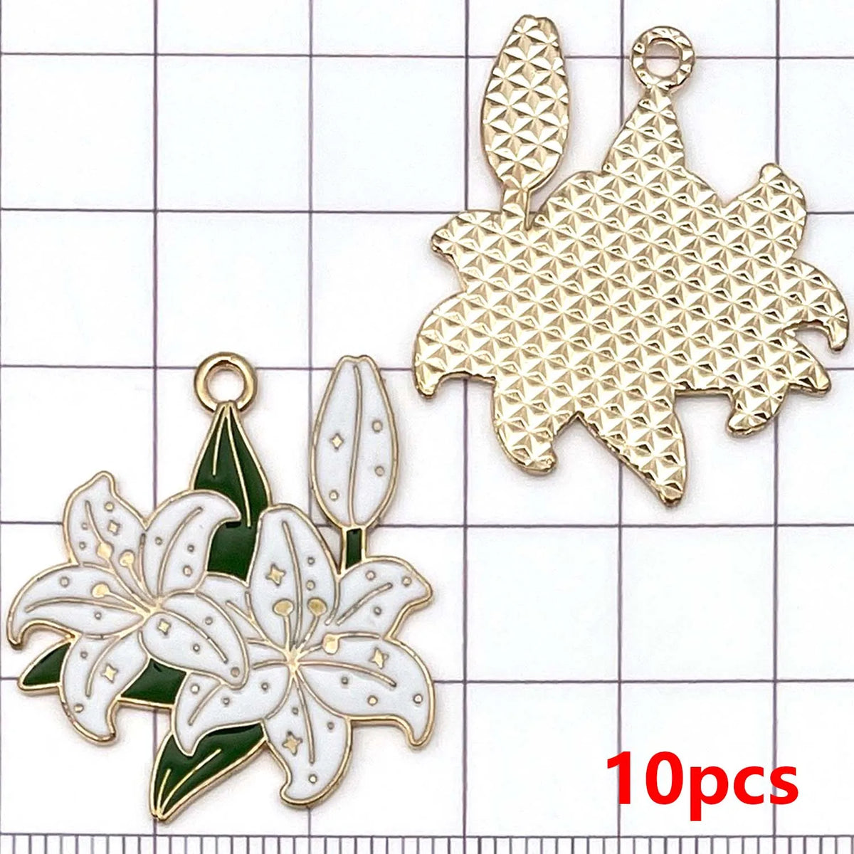 A set of ten gold-toned enamel flower charms, including a large star shape and a lily flower.