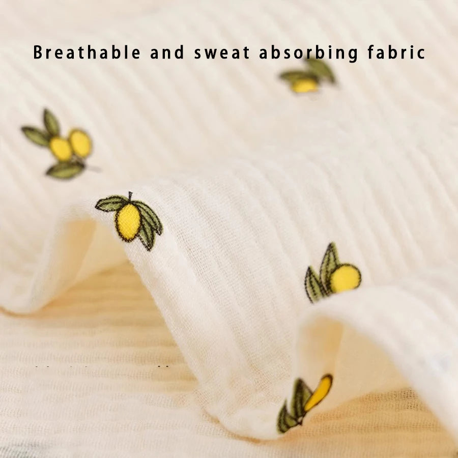 Close-up of a white breathable and sweat absorbing fabric with yellow floral embroidery.