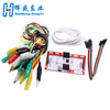 A DIY kit featuring a touch board with alligator clips and jumper wires for electronic projects.