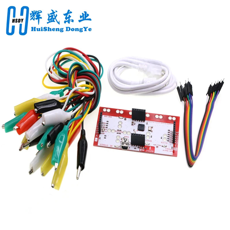 A DIY kit featuring a touch board with alligator clips and jumper wires for electronic projects.