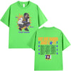 A bright green t-shirt featuring a graphic design related to the Hit Me Hard and Soft Tour.