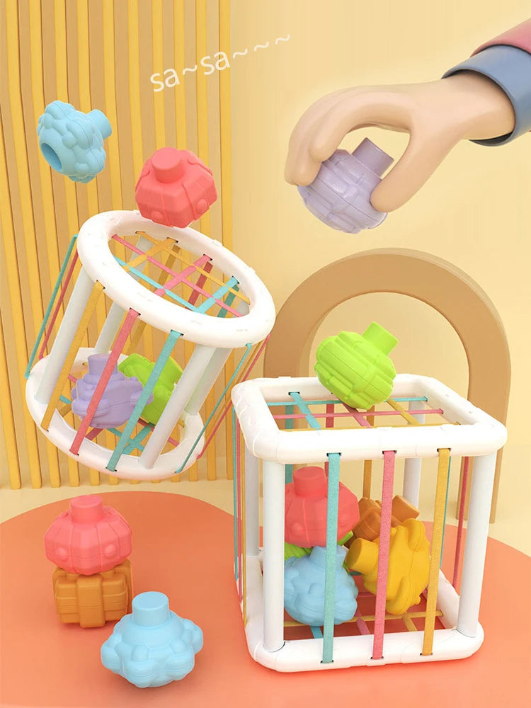 A set of colorful sensory sorting blocks for babies and toddlers, including various shaped blocks in pink, green, purple, and