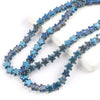 A strand of blue glass star spacer beads used for jewelry making