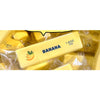 A yellow squishy toy shaped like a banana is visible in clear plastic packaging.