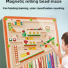 A child is playing with a magnetic rolling bead maze toy designed for pen holding training and color classification counting.